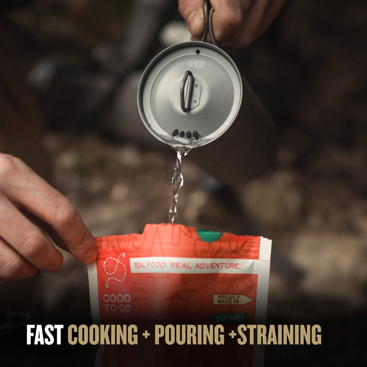 GeoPress® Ti Outer Cup filled with hot water being poured into a Good To-Go meal.
