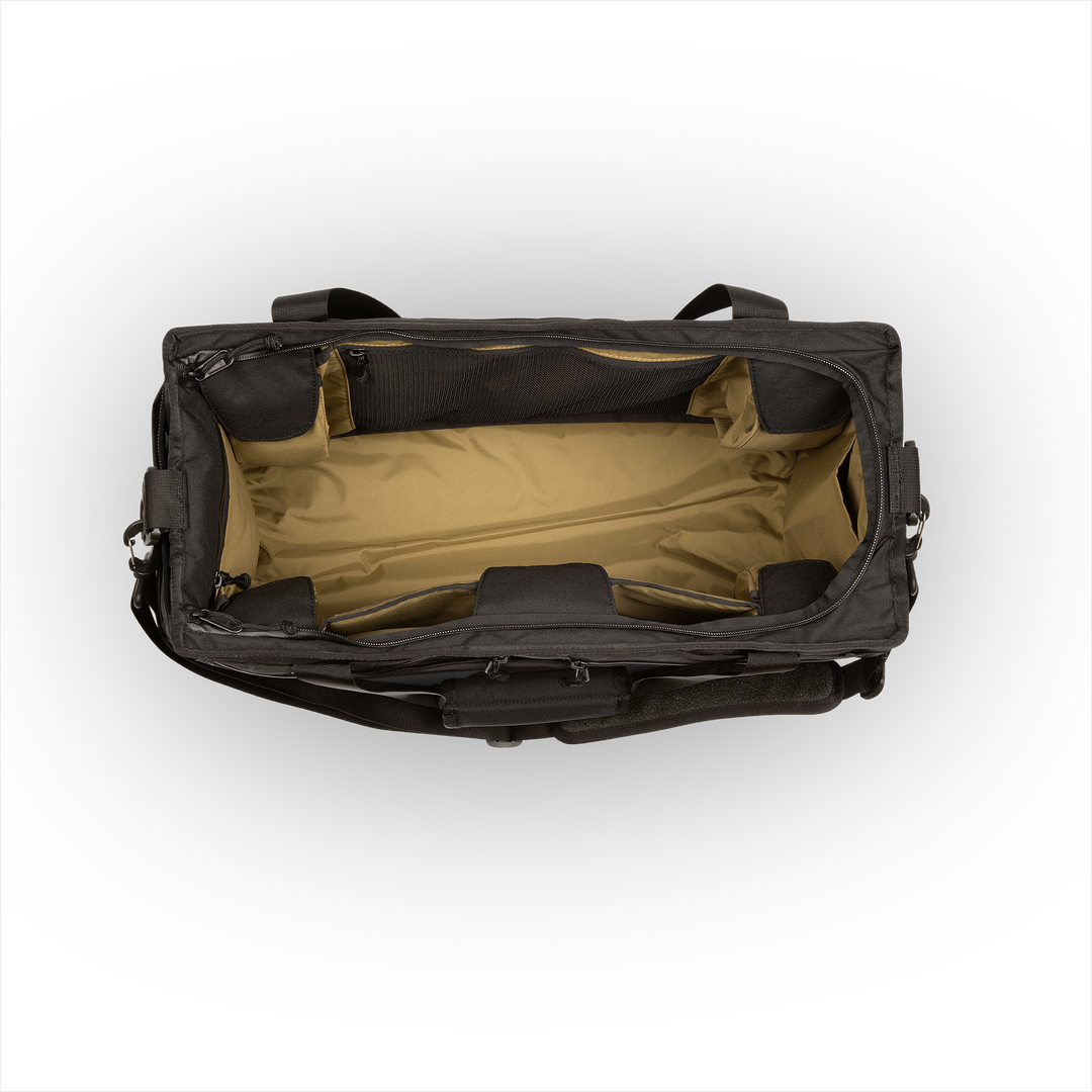 45L Mission Hauler Tote (Covert Black) with main compartment open showing Coyote interior and pockets on a white background / Covert Black
