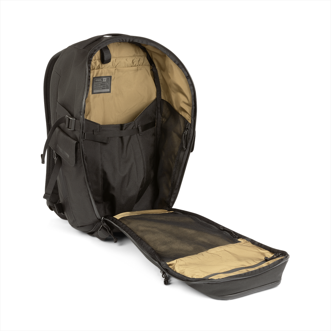 25L Transport Backpack (Covert Black) with open compartment showing Coyote interior on a white background / Covert Black