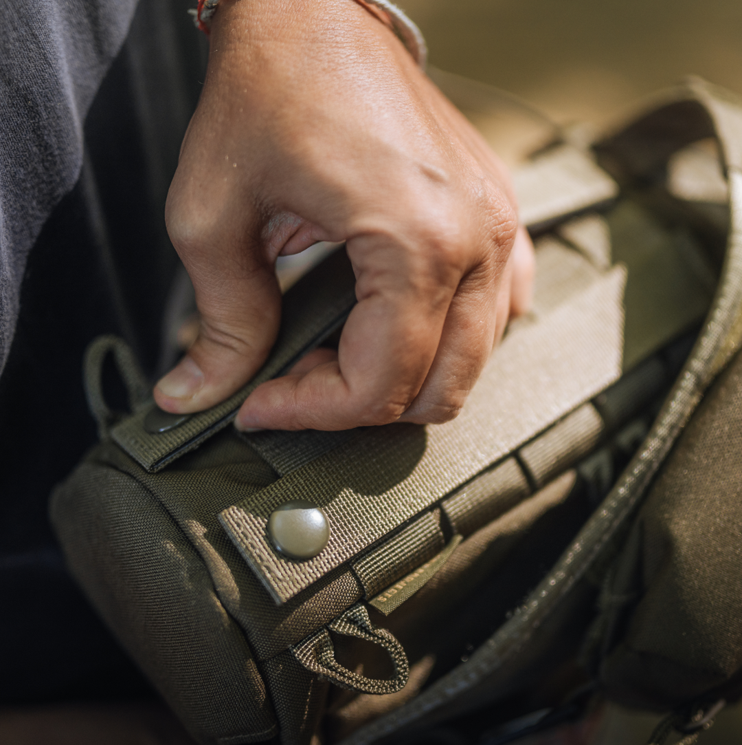 Molle backed Mission Bottle Sling for attaching to any compatible molle panel.