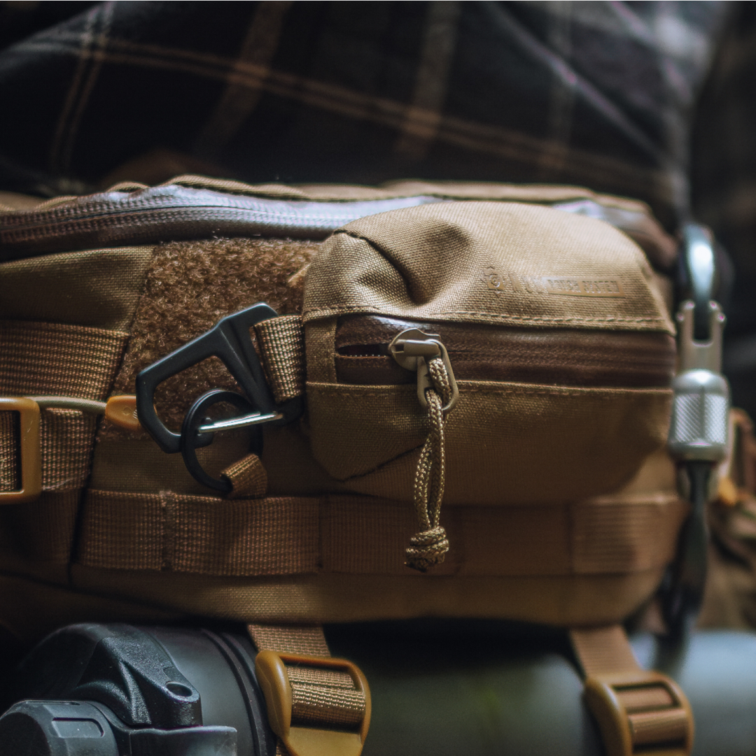 G-MOD Pod Pouch in Coyote Brown color attached to Mission Hip Pack also in Coyote Brown. Grayl GeoPress visible in BottleLock Tie Downs.